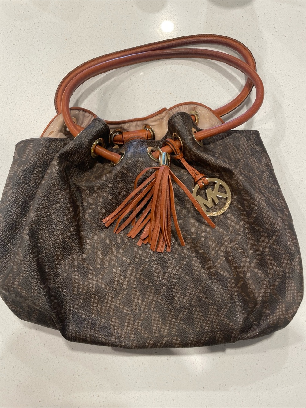 Michael Kors Brown Monogram Drawstring Shoulder Bag with Tan Leather Accents
